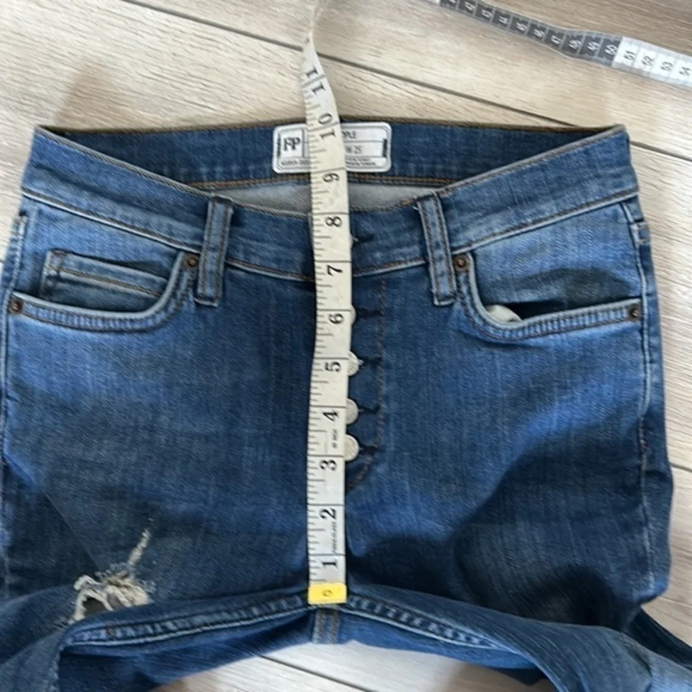 Free People size 25 busted knee button fly jeans